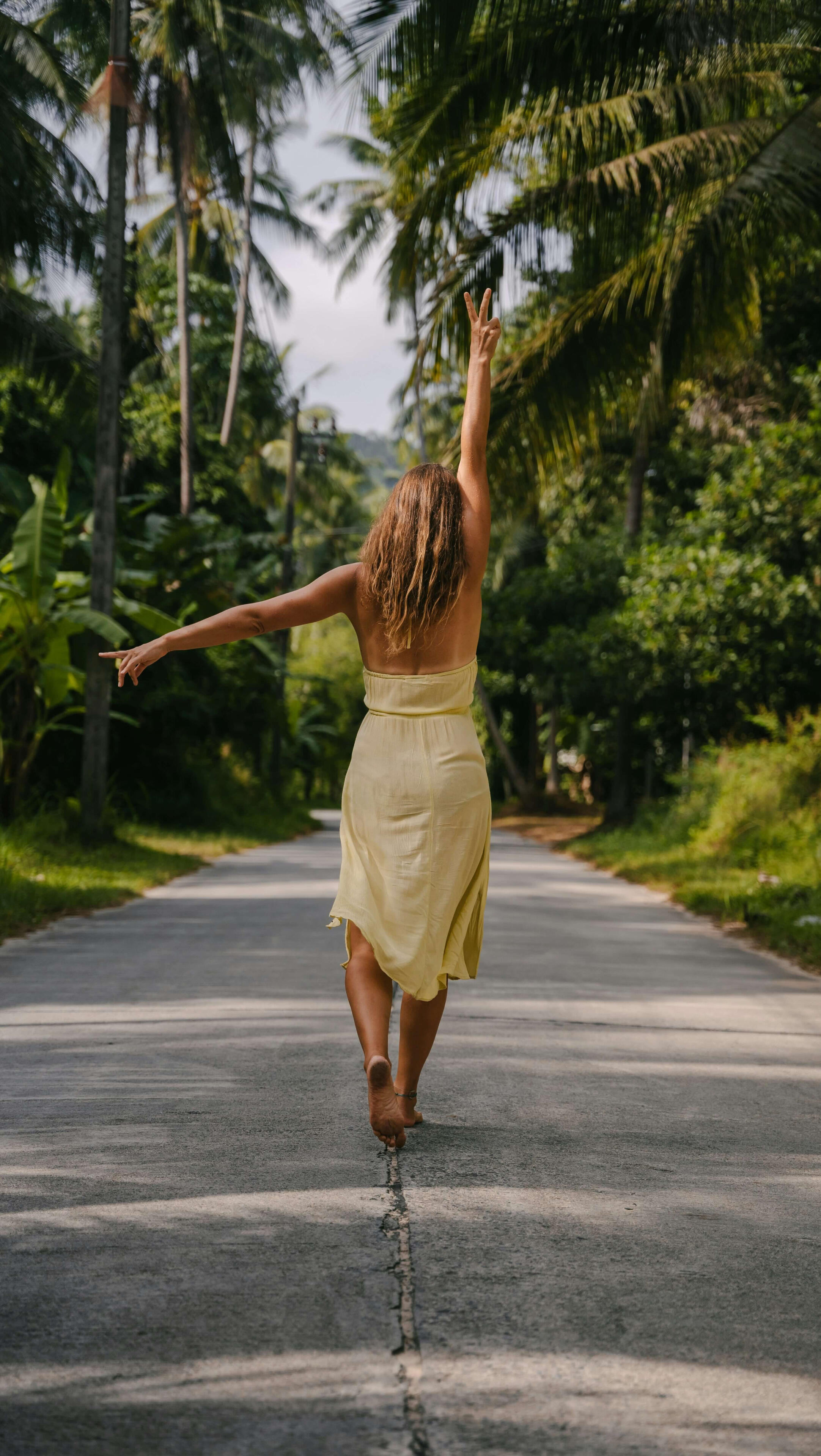 Woman walking barefoot on a peaceful path in nature A woman walking a quiet natural path, symbolising a journey of self-discovery, spiritual growth, self-trust and personal transformation.